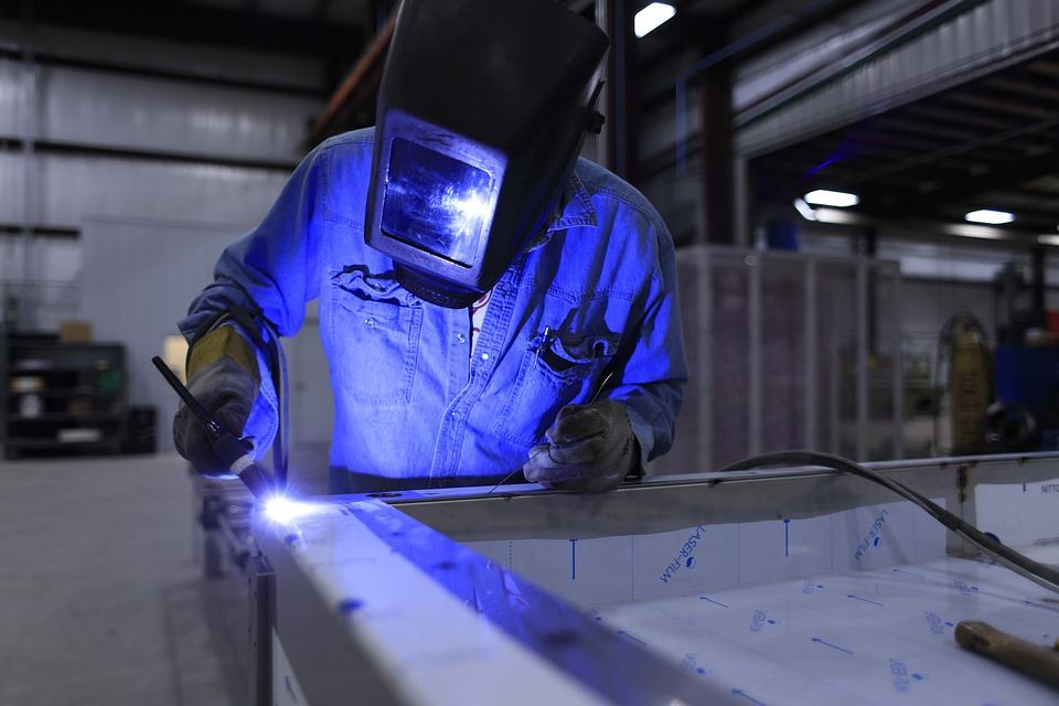 Welder fabricating steel